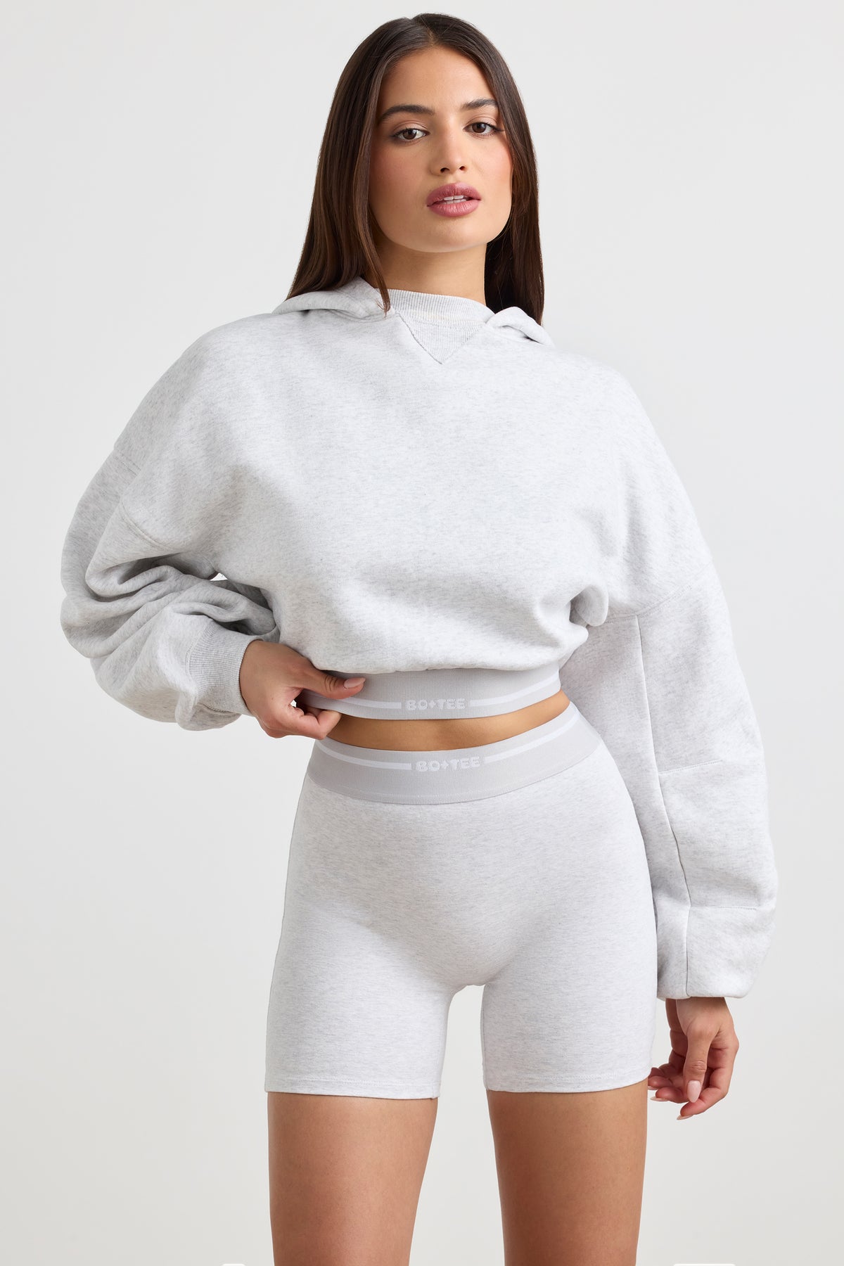 ⁣⁢Stretch-Baumwollfleece Cropped Hoodie in Grau meliert⁤⁣